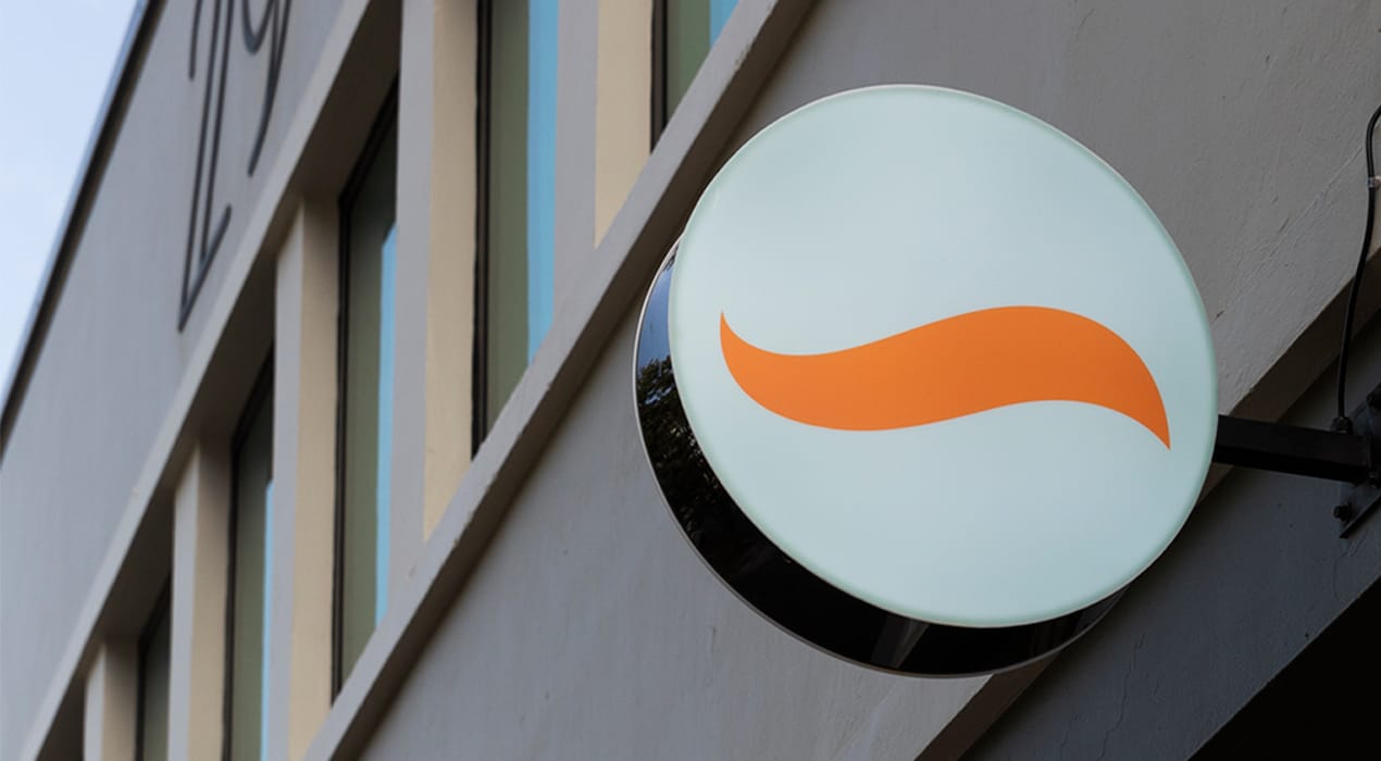 Squirrel (Mortgages, Saving and Investing) logo on a lightbox on the side of Squirrel HQ in Auckland