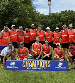 Group of touch rugby players in with Champions sign in front
