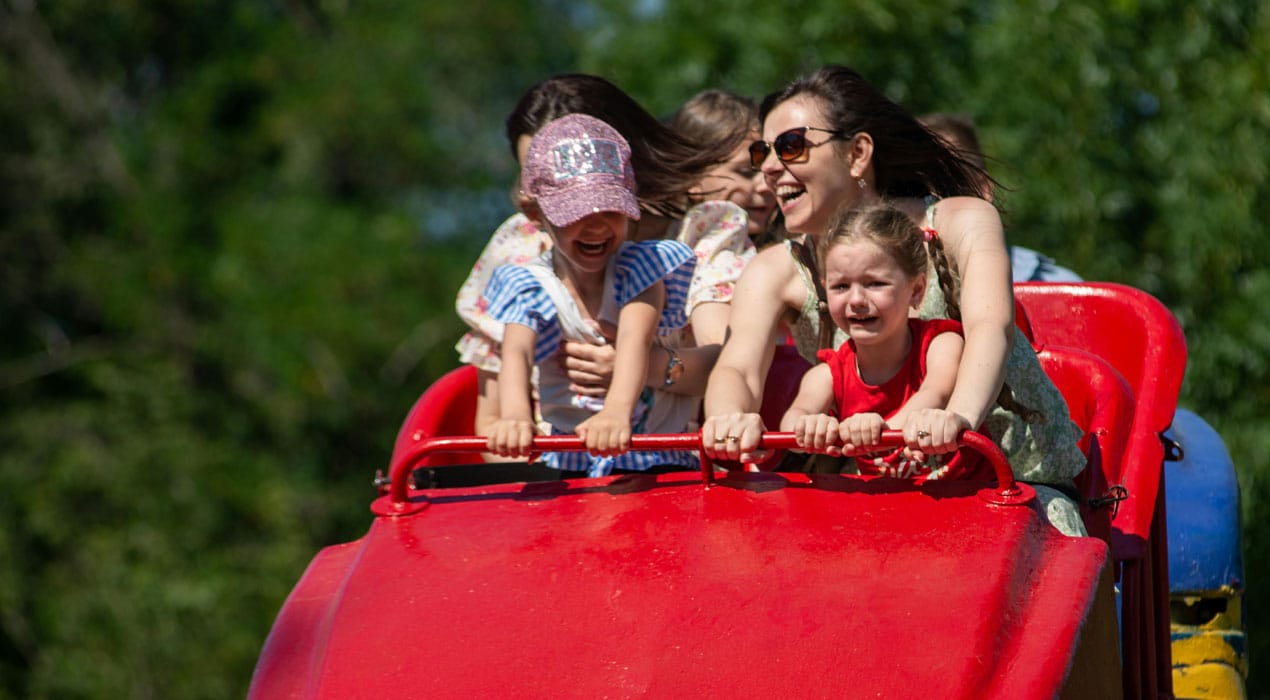 Two women and two young girls on a carnival ride