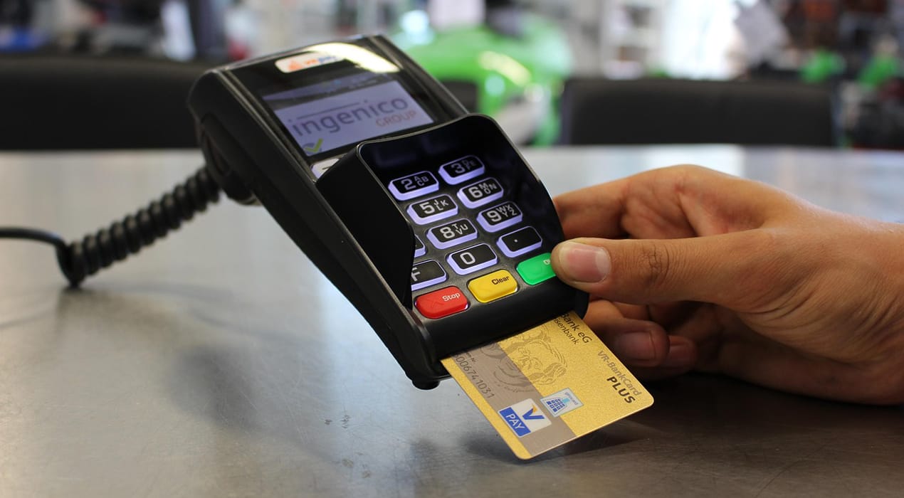 Person making a card payment using an EFTPOS terminal