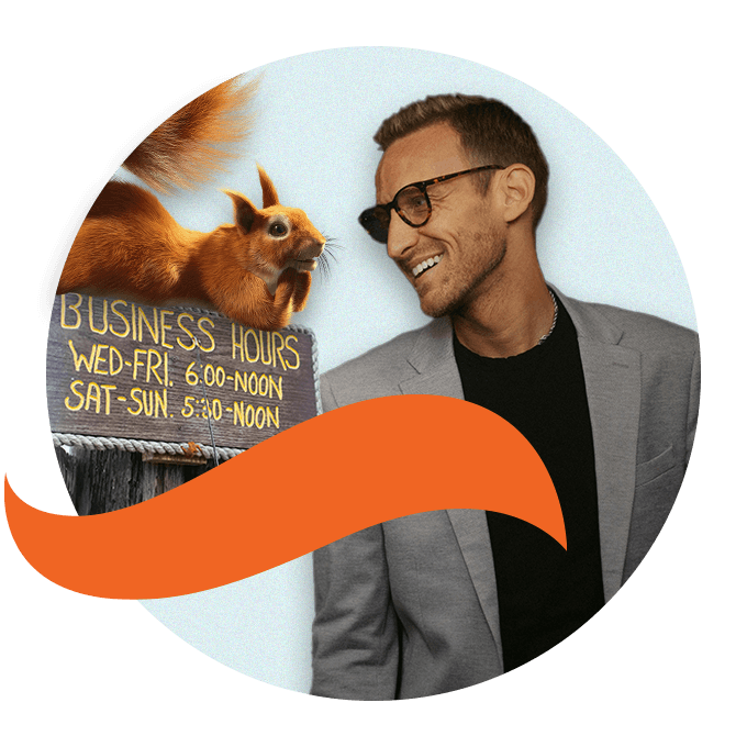 Man with glasses looking over at squirrel sitting on business hours sign